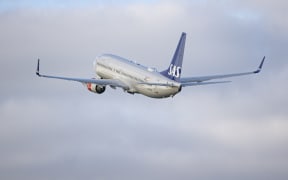 SAS Scandinavian Airlines Boeing 737-800 aircraft as seen during taxiing, rotation, take off and fly phase while departing from Amsterdam Schiphol AMS EHAM. The B738 passenger jet airplane passes in front of a control tower during as it is taking off from Polderbaan runway, the airplane has the registration LN-RRH and the name Freja Viking. SAS is the flag airline carrier of Denmark, Norway and Sweden, the airline has a fleet size of 180 planes and is member of Star Alliance aviation group. According to European media SAS announced 4000 flight cancellations this summer tourist season due to staff shortages and increased demand, 2 years after the Covid-19 Coronavirus pandemic measures relaxed and people want to travel and visit places for holidays. Amsterdam, the Netherlands on April 27, 2022 (Photo by Nicolas Economou/NurPhoto) (Photo by Nicolas Economou / NurPhoto / NurPhoto via AFP)