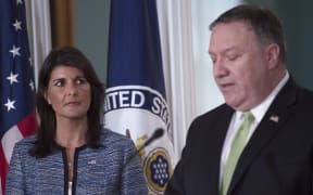 US Secretary of State Mike Pompeo speaks as US Ambassador to the United Nation Nikki Haley looks on at the US Department of State in Washington DC on June 19, 2018.
The United States announced that it is withdrawing from the UN Human Rights Council. / AFP PHOTO / Andrew CABALLERO-REYNOLDS