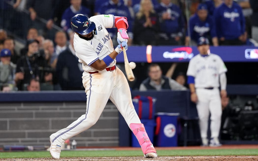 TORONTO, ONTARIO - NOVEMBER 02: First baseman Vladimir Guerrero Jr. #27 of the Toronto Blue Jays doubles during the 11th inning of game seven of the 2025 World Series against the Los Angeles Dodgers at Rogers Center on November 02, 2025 in Toronto, Ontario.   Emilee Chinn/Getty Images/AFP (Photo by Emilee Chinn / GETTY IMAGES NORTH AMERICA / Getty Images via AFP)