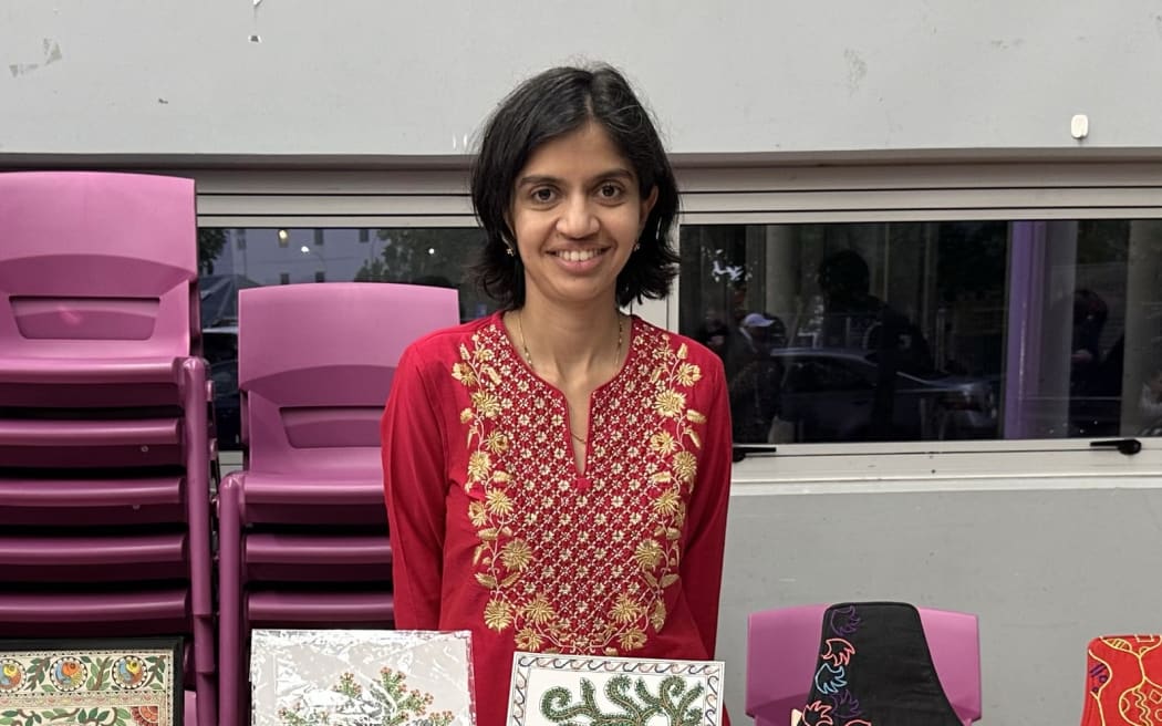 Shailee Adke Barde's stall offers traditional Indian art, hand-painted earrings, bookmarks, prints and embroidered scarves and bags