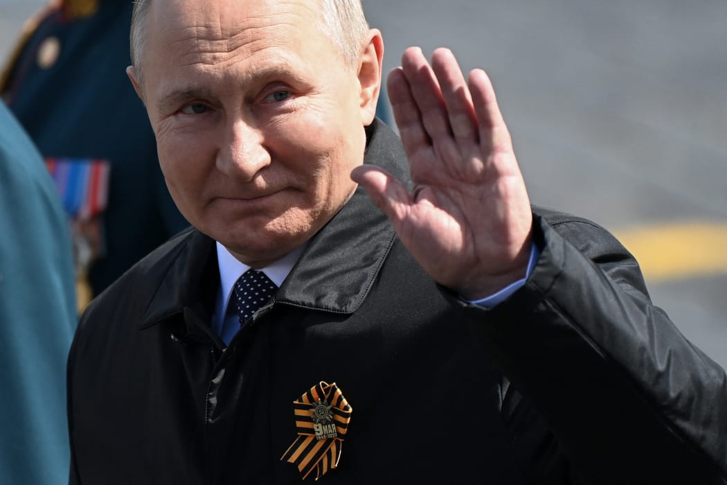 Russian President Vladimir Putin leaves Red Square after the Victory Day military parade in central Moscow on May 9, 2022.
