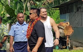 Tulaga (in white shirt) visits crime scene with jury members