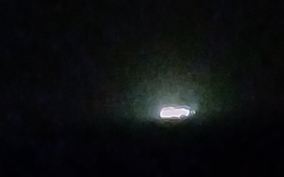 Murky ship lights on a stormy night