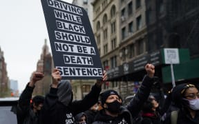 Protestors gather in Washington Square Park in New York April 12, 2021 during a protest after the 20yo was fatally shot.