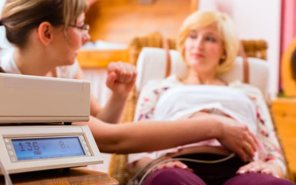 Midwife with pregnant woman