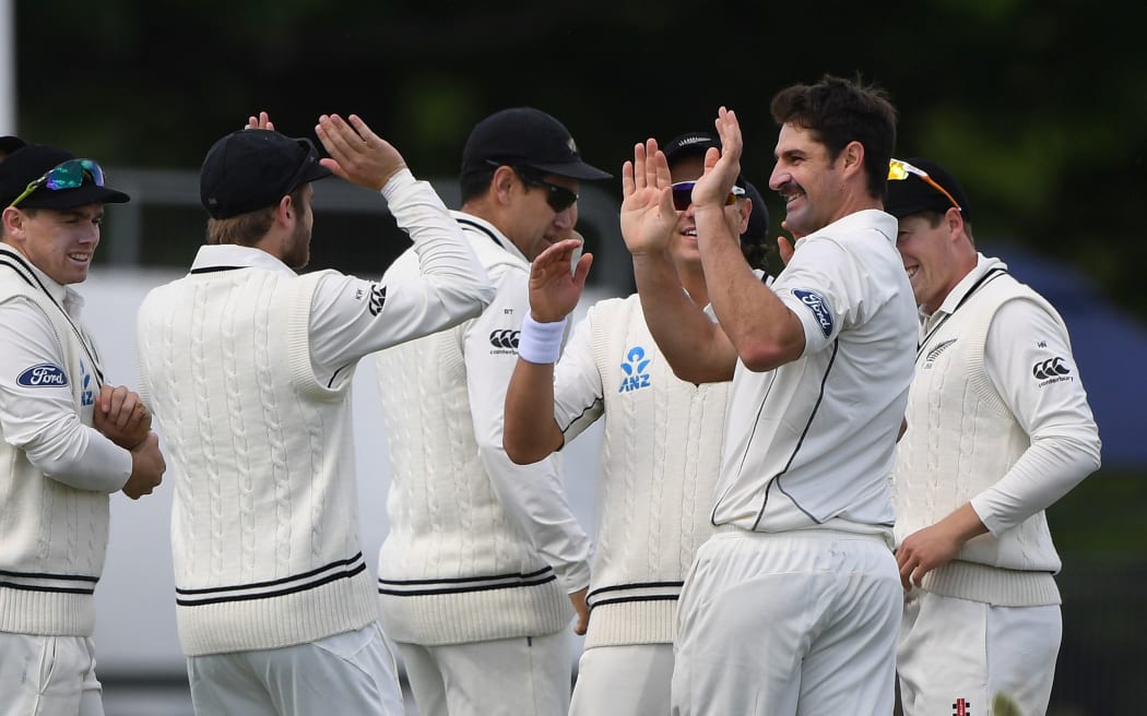 Black Caps celebrate Colin de Grandhomme taking a wicket.
