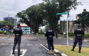 Police survey the streets of Suva