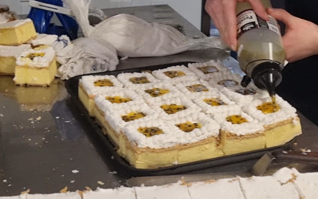 Each custard square has hand-pipe icing and a passionfruit filling.