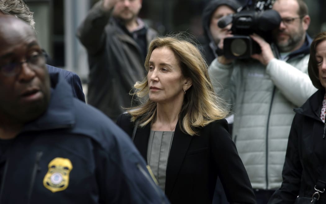 Felicity Huffman arrives at federal court in Boston, 13 May 2019.