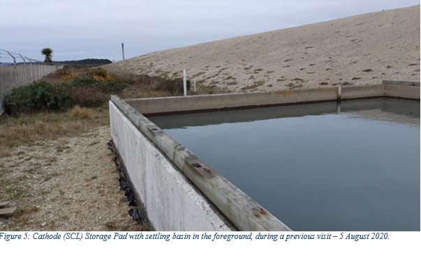 A settling pond beside the concrete pad holding 106,000 tonnes of toxic SCL waste