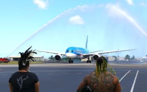 Air Tahiti Nui's Boeing Dreamliner is welcomed at the airport in Tahiti