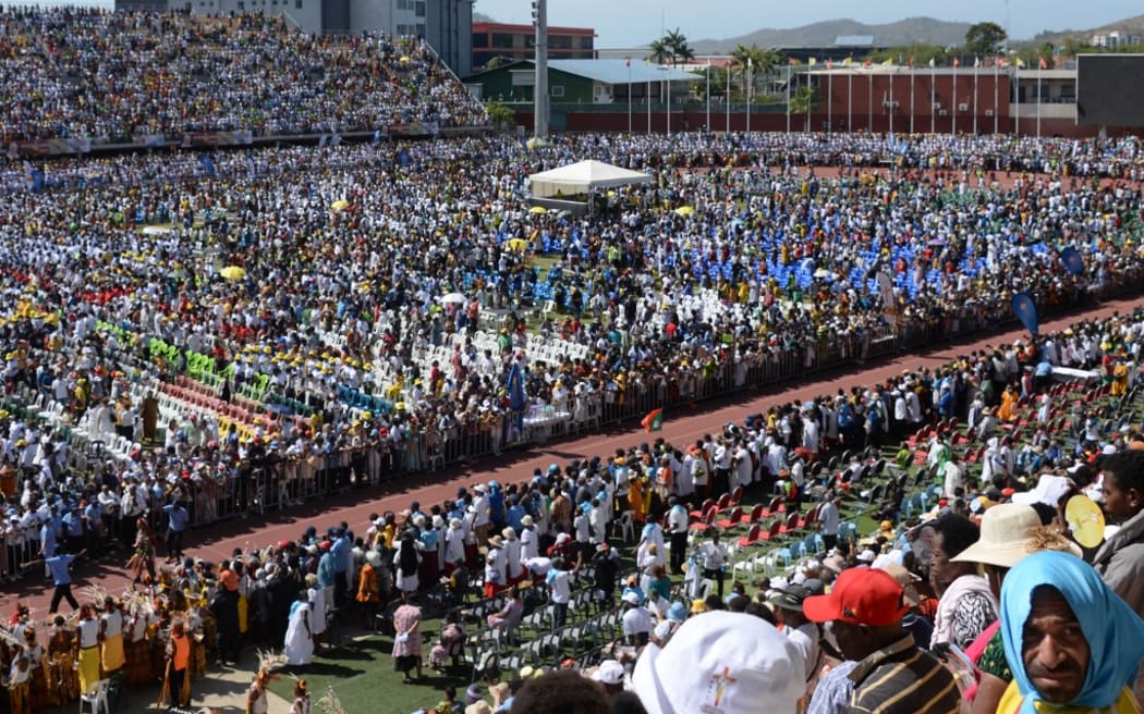 Worshippers gather for a holy mass led by Pope Francis at Sir John Guise Stadium in Port Moresby, Papua New Guinea, on September 8, 2024. (Photo by ANDREW KUTAN / AFP)