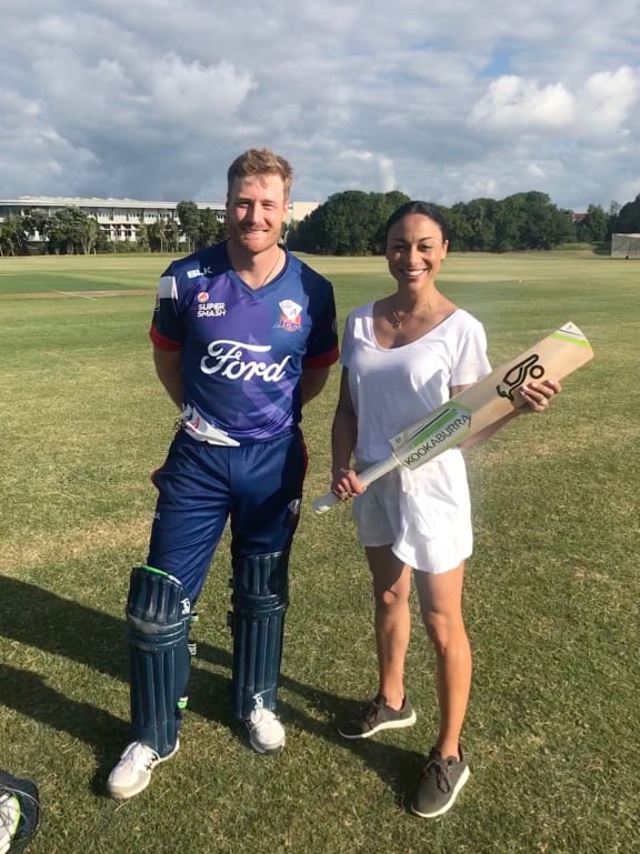Lotto presenter Sonia Gray poses with Black Cap Martin Guptill.