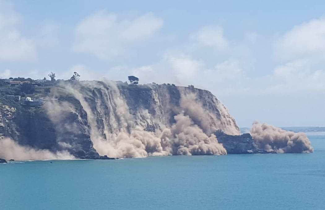 The view from Godley Head Track of a cliff collapsing near Sumner.