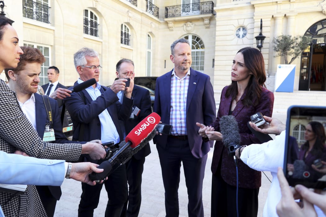 Prime Minister Jacinda Ardern, right, and InternetNZ chief executive Jordan Carter, who chaired the Voices for Action meeting, speak to media in Paris.