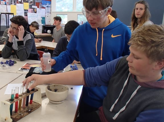 Year 10 students at Onslow College carrying out their experiment with acids and bases.