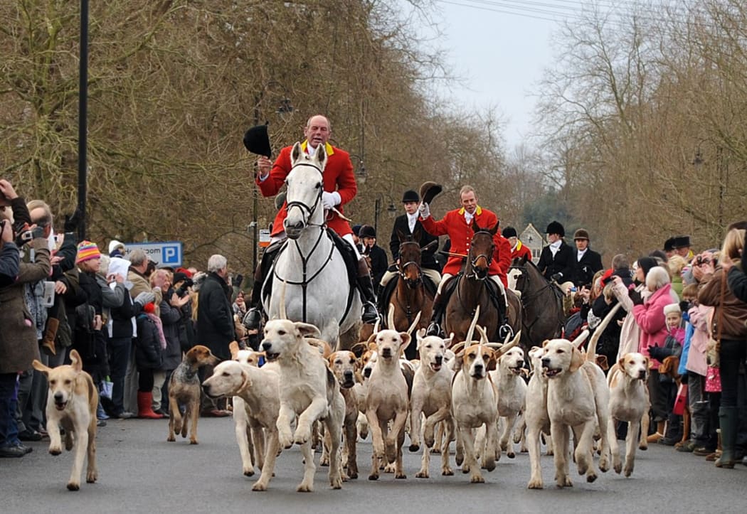 (FILES) A picture taken on December 27, 2010 the Ashford Valley Fox Hunt being applauded as they set off in Tenderten, Kent, south west England.
