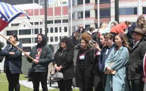 Green Party MPs Marama Davidson and Teanau Tuiono (far right) attend a demonstration at parliament to mark the 59th anniversary of the day West Papuans first raised their nationalist Morning Star flag. 1 December, 2020.