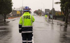 FENZ attend an incident on Blockhouse Bay road following a partial roof collapse along with a street light during a storm in Auckland
