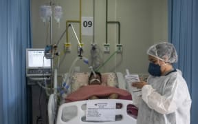 RIO DE JANEIRO, BRAZIL â APRIL 08 : Health workers struggle to save lives in the Intensive Care Unit of the Municipal Hospital Sao Jose, in Duque de Caxias, Rio De Janeiro, on April 8, 2021.