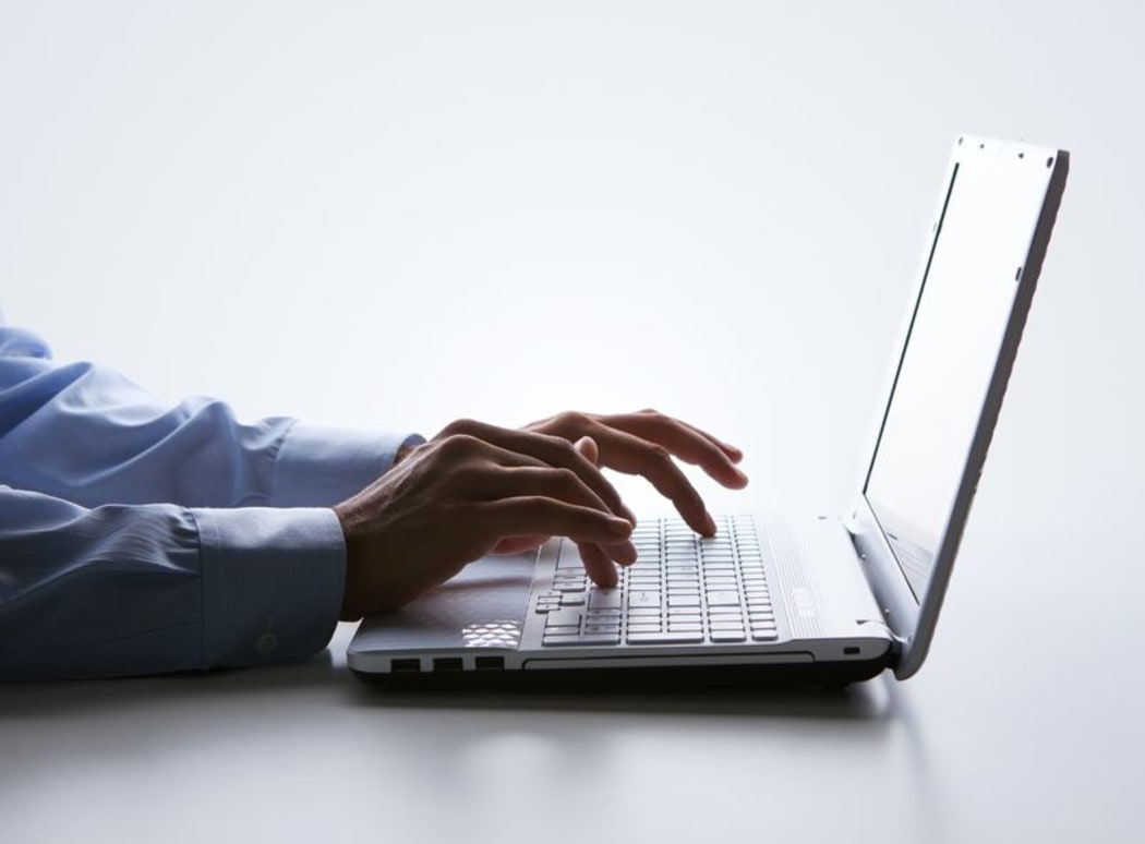 Male hands on a laptop