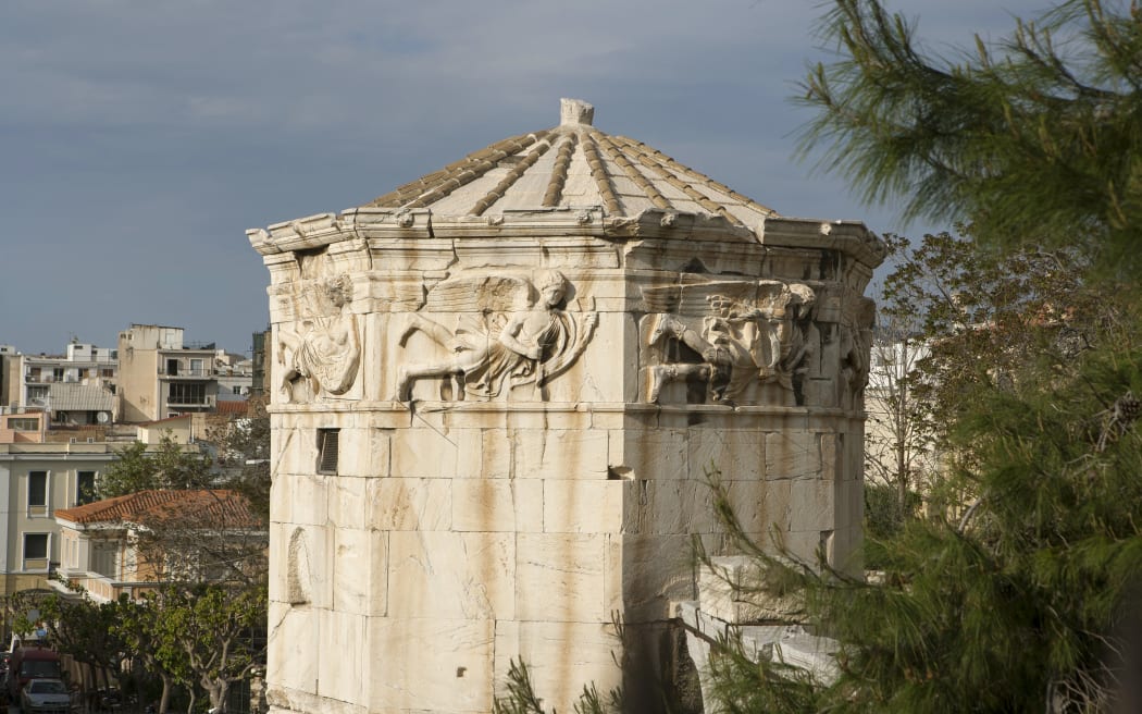 Tower of the Winds, an octagonal marble tower which is a water clock, sundial, and weathervane, 2nd - 1st century BC by Andronicus of Cyrrhus, a Macedonian astronomer, in the Roman Agora, Athens, Greece. The frieze around the tower depicts the 8 wind directions. The Roman Agora is an area built in the 1st century BC during the reigns of Julius Ceasar and Ceasar Augustus and used as a commercial, assembly, or residential gathering place. Picture by Manuel Cohen (Photo by Manuel Cohen / Manuel Cohen / Manuel Cohen via AFP)