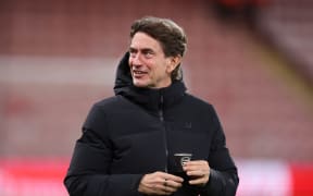 BOURNEMOUTH, ENGLAND - JANUARY 07: Thomas Frank manager / head coach of Tottenham Hotspur holding a cup with the Arsenal club badge on ahead of the Premier League match between Bournemouth and Tottenham Hotspur at Vitality Stadium on January 07, 2026 in Bournemouth, England. (Photo by Catherine Ivill - AMA/Getty Images)