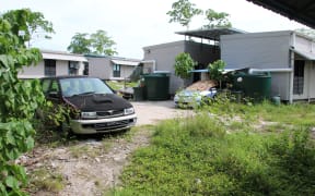 A cluster of corrugated iron huts resembling military barracks jut out of Nauru's sweltering rocky landscape to reveal refugee settlement camp number five, a place defined by desperation and rarely visited by outsiders. (Photo by Mike LEYRAL / AFP)