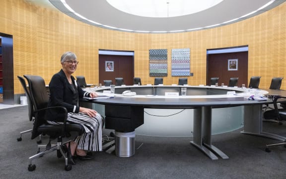 Secretary of Cabinet, Rachel Hayward sits in her chair next to the Prime Minister's place at the cabinet table.