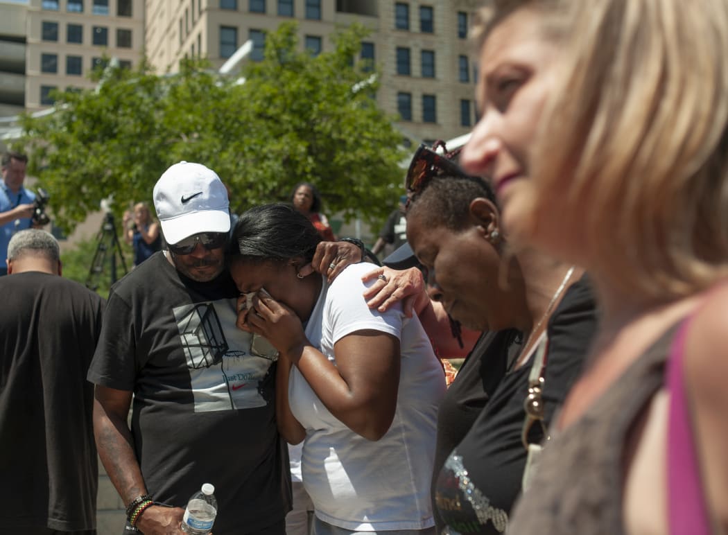 People gather for a vigil for the victims of the mass shooting in Dayton, Ohio.