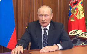 This handout picture released on September 21, 2022 by the Kremlin shows Russian President Vladimir Putin speaking during a televised address to the nation in Moscow. - President Vladimir Putin on Wednesday announced "partial" mobilisation in Russia, in an escalation of what Moscow calls its military operation in pro-Western Ukraine.