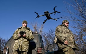 Servicemen from an artillery unit of the 128th Mountain Assault Brigade of the Ukrainian Ground Forces are training to use a drone during a training session in Ukraine, on 28 December, 2023.