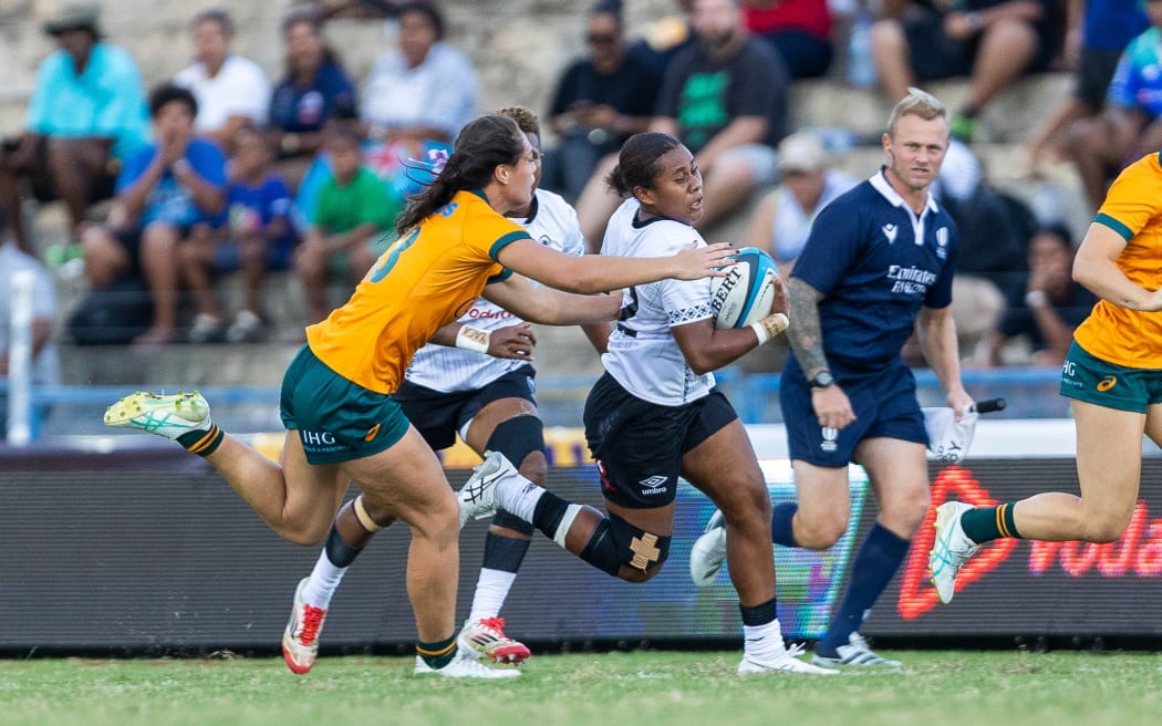 Fijiana centre Josivini Naihamu tries to run away from the Wallaroos defence on Saturday.