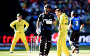 Grant Elliott makes his 50 in the final of the Cricket World Cup against Australia.