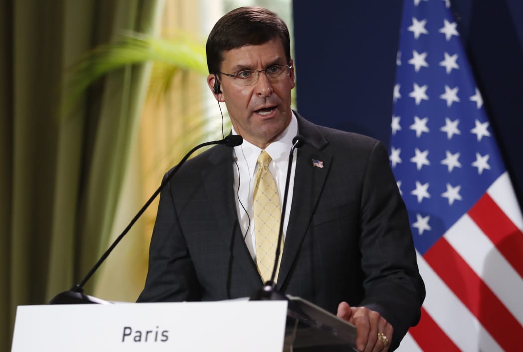 (FILES) In this file photo taken on September 07, 2019 US Secretary of Defense Mark Esper (L) holds a press conference
