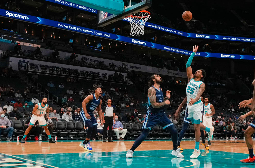 Charlotte Hornets forward P.J. Washington shoots over Memphis Grizzlies center Steven Adams during the first quarter at Spectrum Center.