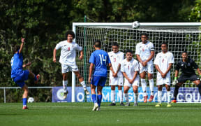 Tonga defends a Samoa free-kick