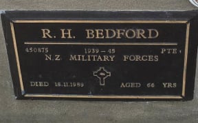 The bronze plaque on the grave of WWII veteran Raymond Bedford, which was stolen on Sunday - just two days before Anzac Day.