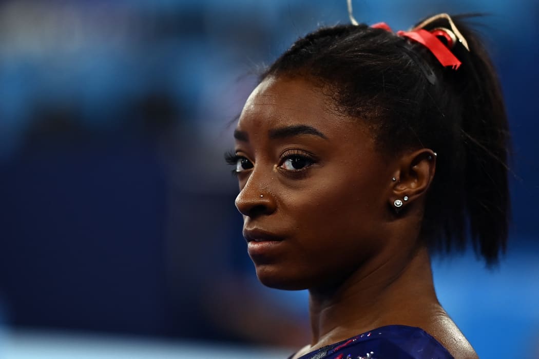 Simone Biles gets ready to compete in the uneven bars event of the  artistic gymnastics women's qualification during the Tokyo 2020 Olympic Games on 25 July 2021.