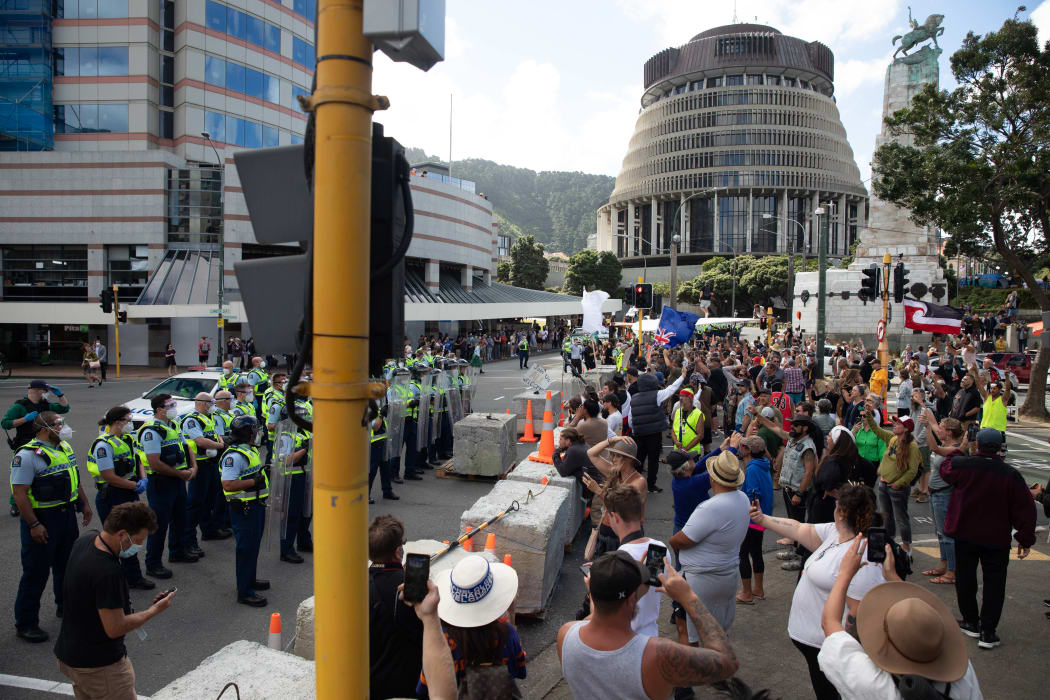 Protestors and Police standoff as police move concrete barricades