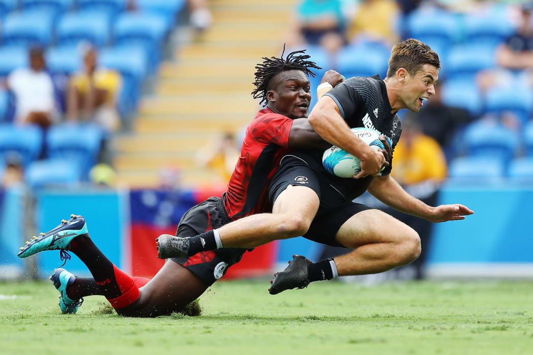 Andrew Knewstubb of New Zealand on his way to score a try.