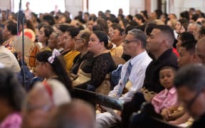 Tongan's gather at St Mary's Cathedral in Nukualofa to commemorate the one year anniversary of the eruption and tsunami.