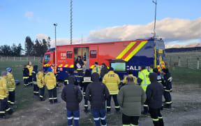 Fire crews attend a morning briefing on Sunday about the fire near Waitaki which has destroyed more than 800 hectares after a burn-off got out of control.