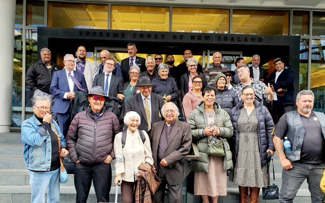 Te Kaunihera Kaumatua o Tūhoe standing outside the Supreme Court in Welilngton