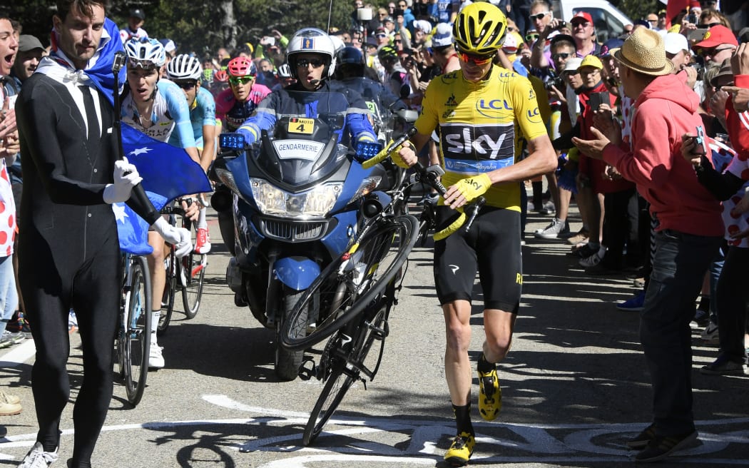 Chris Froome was forced to run up the slopes of the Mont Ventoux briefly