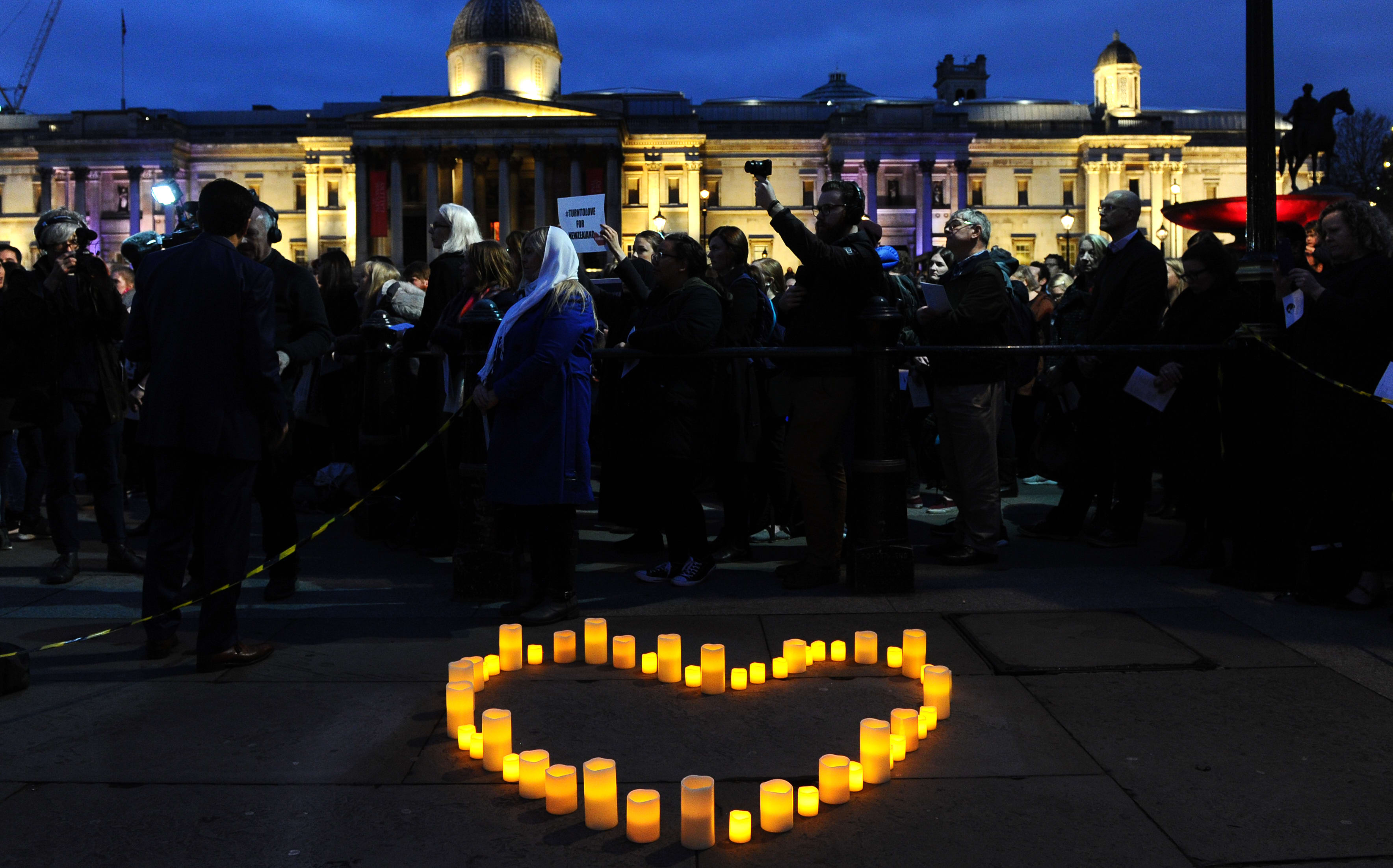 Members of the London New Zealand community and well-wishers attend a vigil at Trafalgar Square in central London on March 21, 2019 in honour of the victims of the Christchurch mosque attacks.