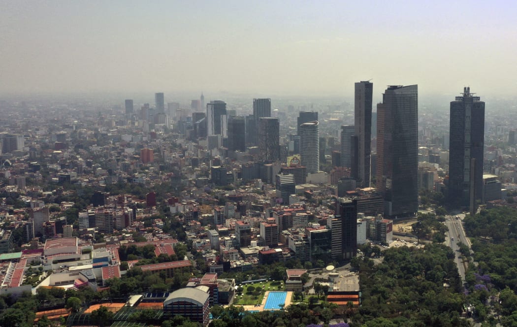 Aerial view showing low visibility due to air pollution in Mexico City, on April 1, 2020, during the coronavirus pandemic.