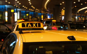 A file photo of a line of taxis at an airport