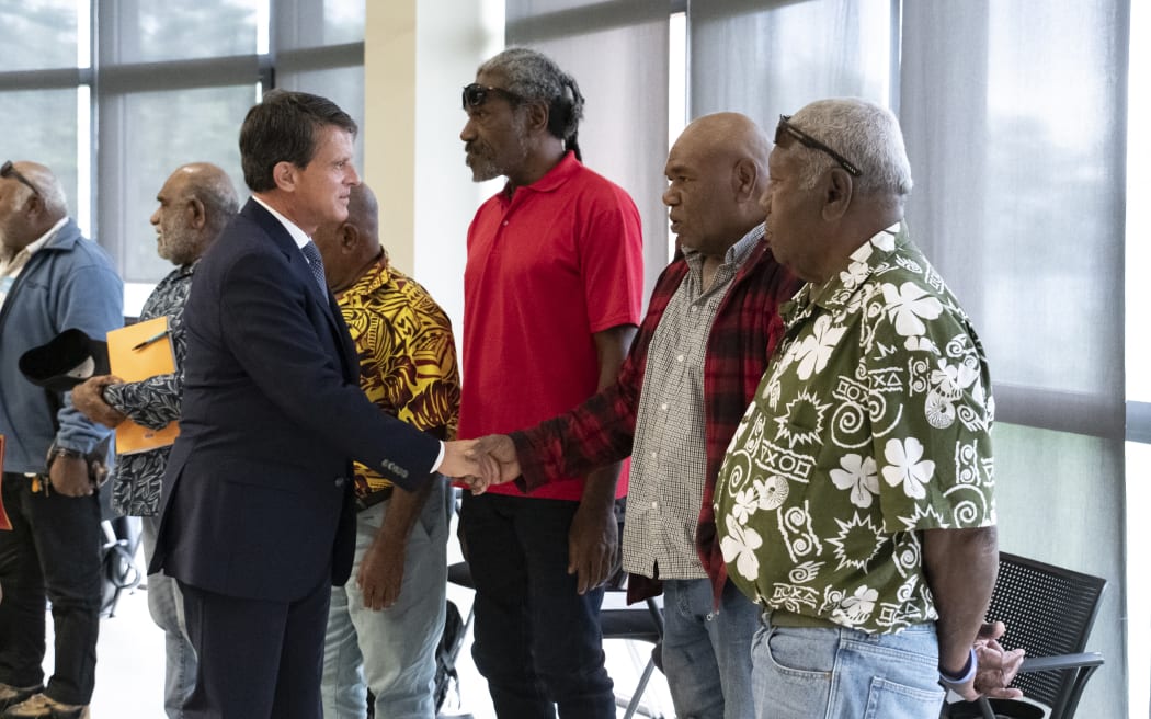 French Overseas Minister Manuel Valls (L) greets members of the Customary Senate in Noumea, in the French overseas collectivity of New Caledonia, on August 20, 2025. Valls is in New Caledonia in an attempt to rescue the Bougival agreement. The Kanak and Socialist National Liberation Front (FLNKS), New Caledonia's main pro-independence movement, confirmed on August 13 its rejection of the Bougival agreement, signed on July 12 with the French government, which would redefine the institutional future of the archipelago. (Photo by Delphine MAYEUR / AFP)