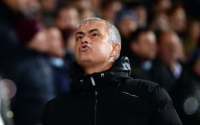 Jose Mourinho, Manager of Chelsea blows away a bubble prior to kick off. 2014.